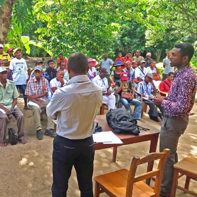 Joxe Jaofeno, Madagascar Program Manager, updates community members near Marojejy National Park about a grant from Seacology.