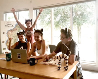 A group of four people celebrating lemurs