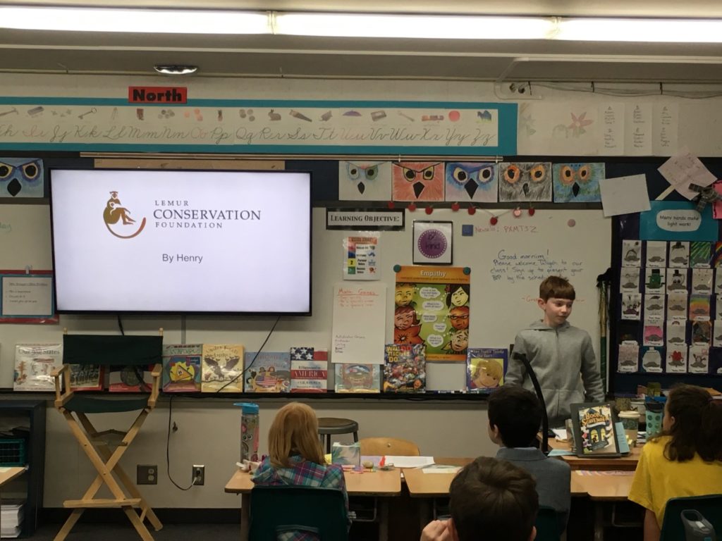 Young student Henry Hunt presents his project on lemurs to his class.