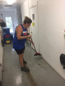 Intern sweeping floor